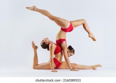  two women contortionist exercising gymnastic yoga silhouette 