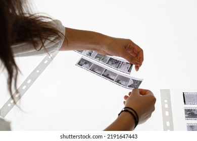 Two Women Cut 35mm Film Negatives In A Photography Lab Light Table Isolated On White Closeup Organised High Quality Analog Hobby Person Cinema Business Laboratory Work Tidy Chemistry Studio Photos HQ