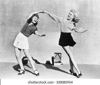 Two Women Dancing Outside