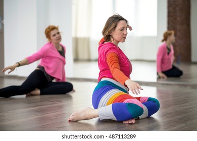 Two women doing physical practice