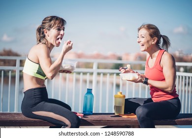 Two Women Eat Outdoors After Training