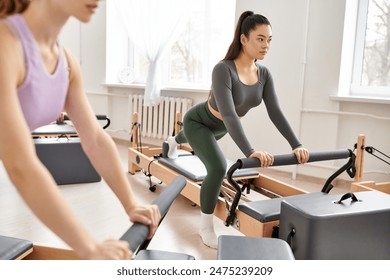 Two women engaging in a fitness routine with exercise equipment in a vibrant room. - Powered by Shutterstock