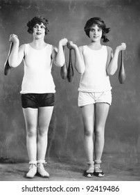 Two Women Exercising With Juggling Pins