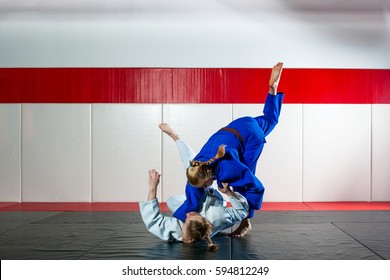 Two Women Fight Judo On Tatami