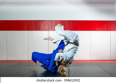 Two Women Fight Judo On Tatami