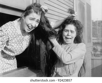 Two Women Fighting And Pulling Each Other's Hair