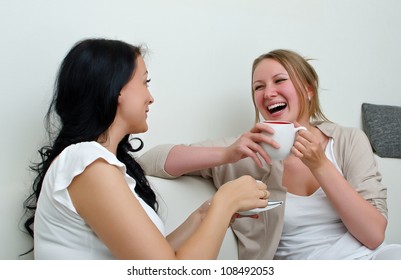 Two Women Friends Chatting Over Coffee At Home