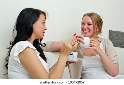 Two Women Friends Chatting Over Coffee At Home