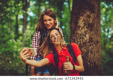 Similar – Frauenfreunde lachend bei Spaziergängen im Wald