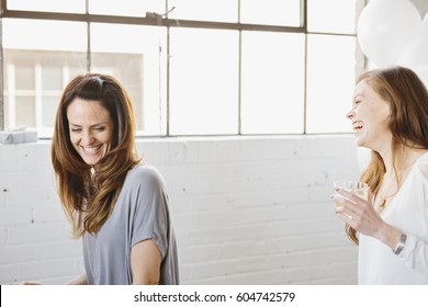 Two Women Laughing Together