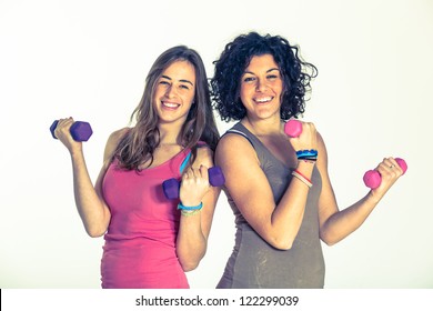 Two Women With Light Weights At Gym