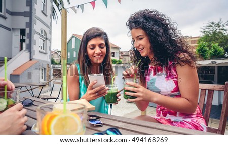 Similar – Young women couple drinking healthy drinks outdoors