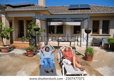 Similar – Image, Stock Photo Two solar panels lying in the green grass