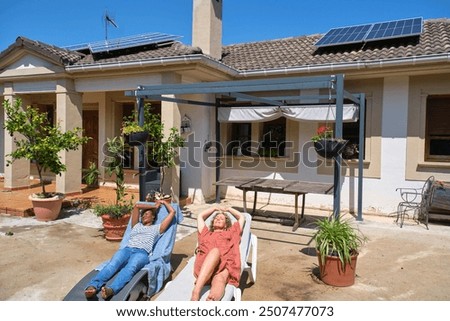 Similar – Image, Stock Photo Two solar panels lying in the green grass