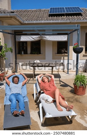 Similar – Image, Stock Photo Two solar panels lying in the green grass