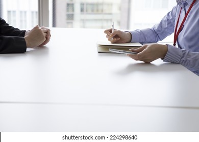 Two women meeting in the office - Shutterstock ID 224298640