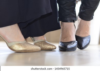 Two women modeling nice shoes