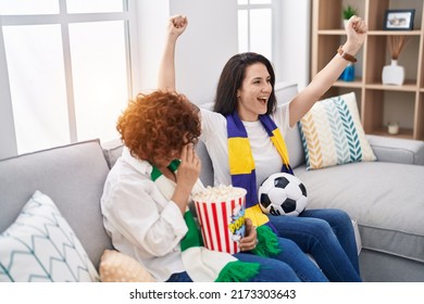 Two Women Mother And Daughter Supporting Soccer Match At Home