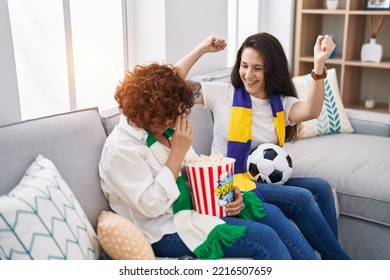 Two Women Mother And Daughter Supporting Soccer Match At Home