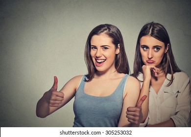 Two women optimistic lady having solution and bored, annoyed clueless sad woman on gray wall background. Human emotion face expression feeling, life approach. Bipolar disorder concept - Shutterstock ID 305253032