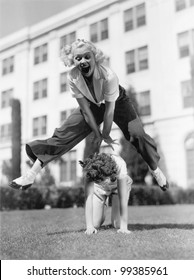 Two Women Playing Leap Frog Together