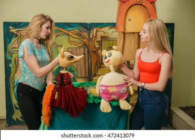 Two Women Are Playing With Puppets, Getting Along Concept