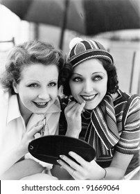 Two Women Putting On Makeup