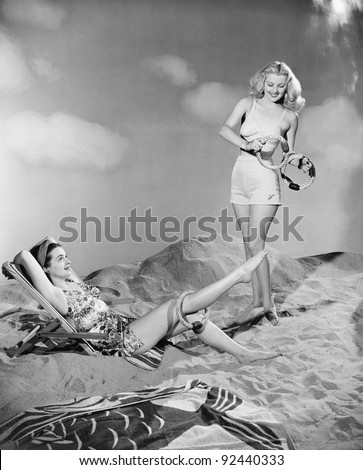 Two women relax at the beach