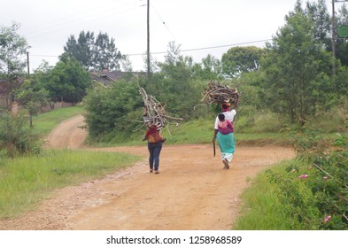 Two women returning from collecting firewood in Swaziland - Powered by Shutterstock