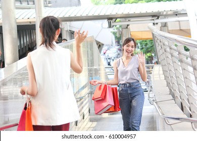 Two Women Say Hi In Shopping Time With Happy Woman.