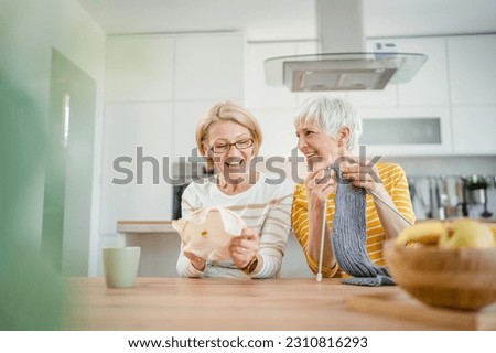 two women senior mature caucasian friends or mother and daughter or sisters knitting and embroidery during leisure time at home needlework concept bright photo happy and relaxed enjoy free time