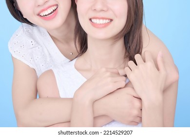 Two Women Showing Bright White Teeth