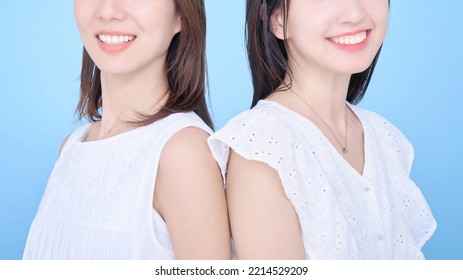 Two Women Showing Bright White Teeth