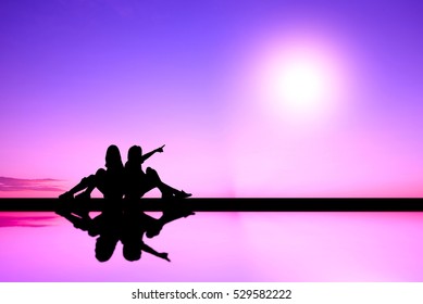 Two Women Sitting Back To Back. Silhouette : Purple Mood.