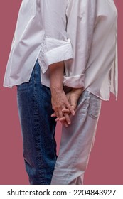 Two Women Standing Back To Back And Feeling Close