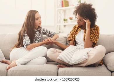 Two women talking about problems at home. Friendship consoling and care, unhappy girl support her girlfriend, copy space