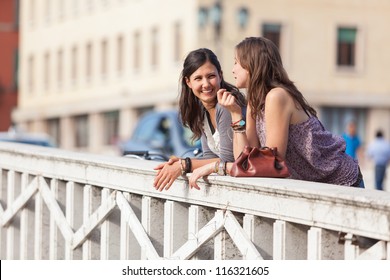 Two Women Talking In The City