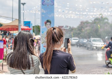 Two women took Songkran Festival  in-THAILAND.
 Songkran Festival is celebrated in Thailand as the traditional New Year's Day from 13 to 15 April by throwing water at each other, on  2017 in Phayao