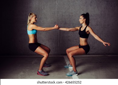 Two Women Training Legs Together