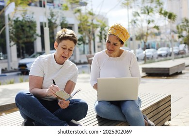 two women working on the street