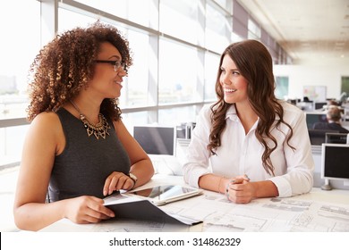 Two Women Working Together At An Architect?s Office