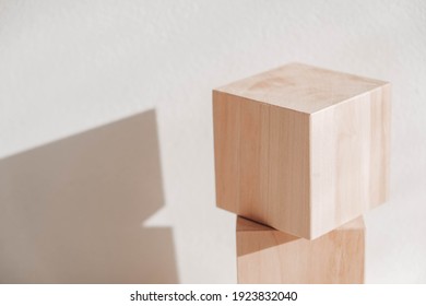 Two wooden blocks from natural wood on a white background. Copy, empty space for text.