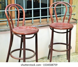 Two wooden brown chairs on high legs. - Shutterstock ID 1534508759