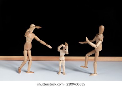 Two Wooden Mannequins Attacking, Abusing And Intimidating The Third One