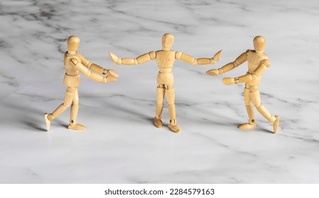 two wooden mannequins and psychologist in family therapy - Powered by Shutterstock