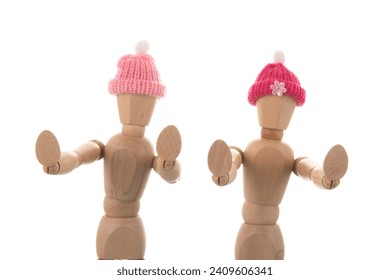 Two wooden mannequins with winter hat saying no isolated over white - Powered by Shutterstock