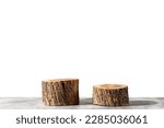 Two wooden round saw cuts isolated on a white background. Natural podiums for advertising cosmetic products and body care. Copy space
