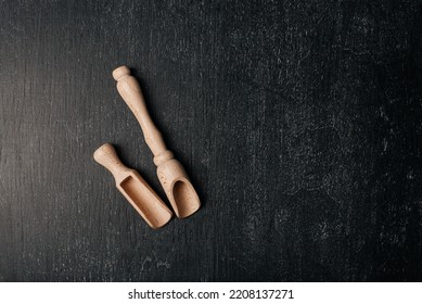 Two Wooden Spoon A Black Background. Wooden Kitchen Accessories