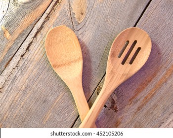 Two wooden spoons in a rustic country kitchen - Powered by Shutterstock