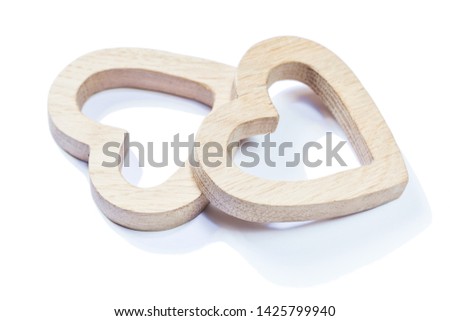 two wooden symbol toys hearts isolated on white